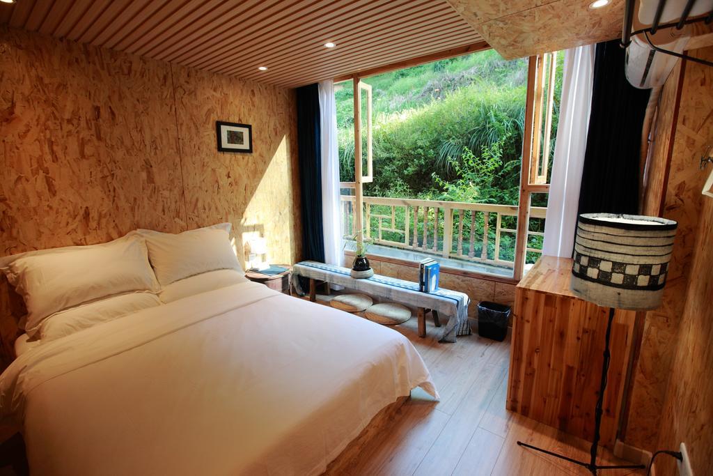 Tong Sang Art Hotel Liping Quarto foto