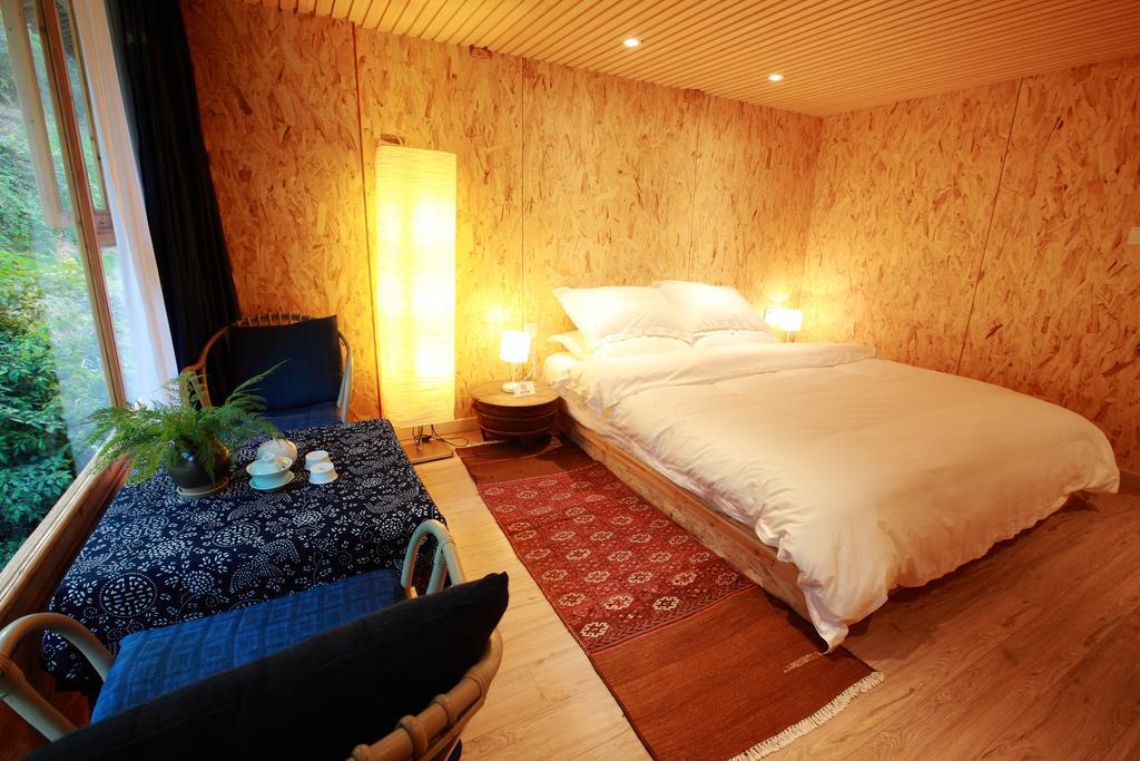Tong Sang Art Hotel Liping Quarto foto