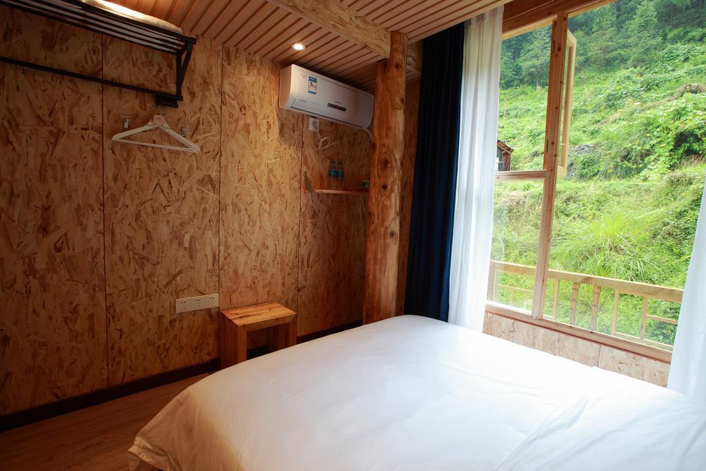 Tong Sang Art Hotel Liping Quarto foto