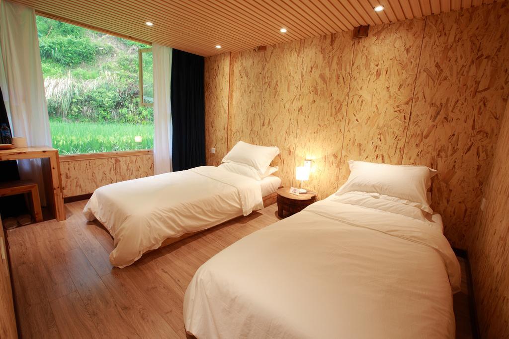 Tong Sang Art Hotel Liping Quarto foto
